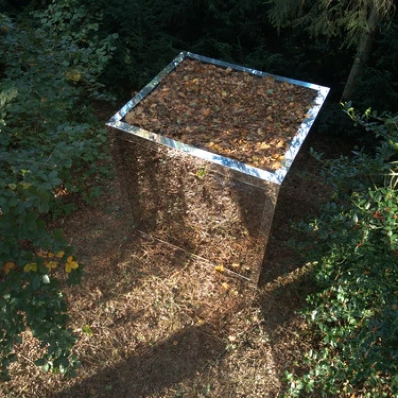 Luxury cube-shaped design outdoor sauna with modern mirror glass finish, in the garden for the ultimate outdoor wellness experience.